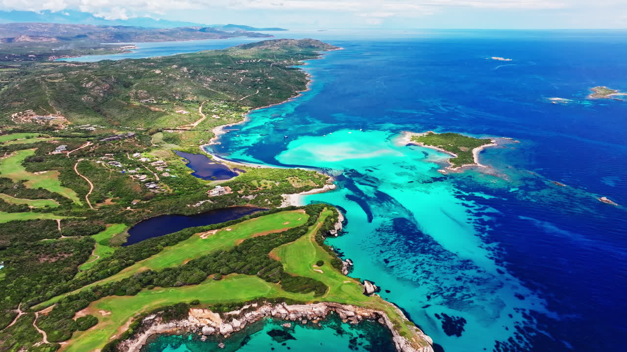 Aerial drone view of beautiful coastline of Corsica, France. High view of the colorful turquoise sea and the picturesque green landscape. Bird's eye view of the beaches. Summer holidays destination