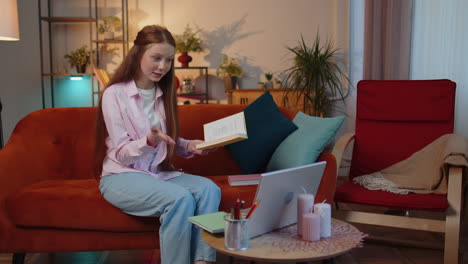 Child-girl-student-study-at-home-on-laptop-computer-making-conference-video-call-talking-to-webcam