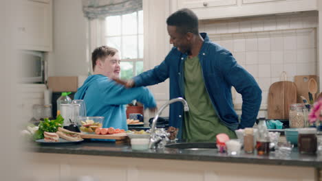 multi-ethnic-father-and-son-dancing-in-kitchen-teenage-boy-with-down-syndrome-having-fun-dance-with-dad-celebrating-happy-family-at-home