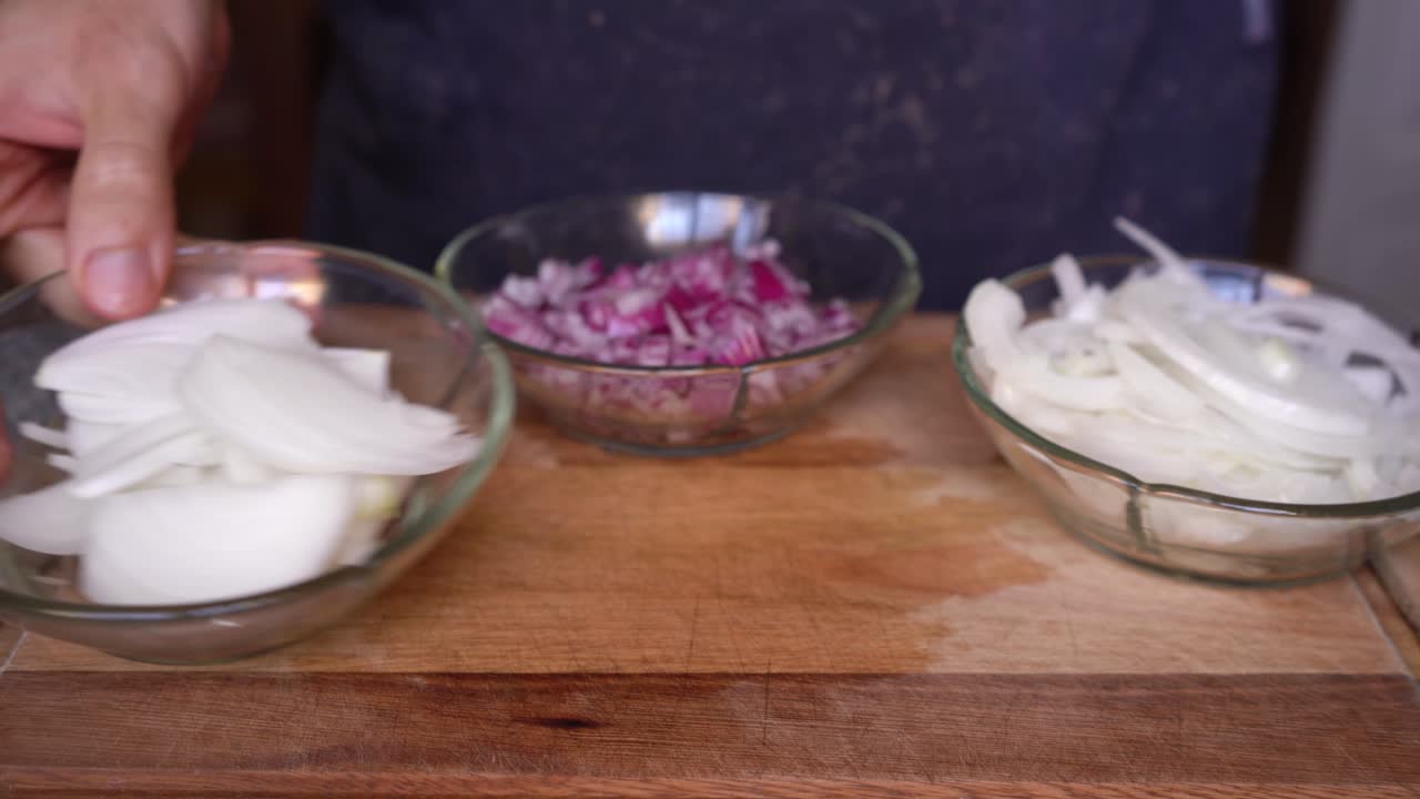 Person showing different types of onion cuts, slices, dice, brunoise