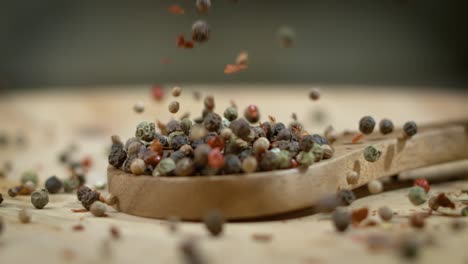 Mixed-peppercorns-in-a-super-slow-motion.-Dry-mix-peppercorns-close-up.