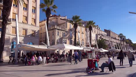 daytime establishing shot of ther waterfront promenade in split croatia