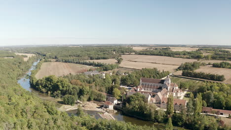 Aerial-drone-point-of-view-of-the-beautiful-Abbaye-de-Fontgombault-or-Abbey-of-Notre-Dame