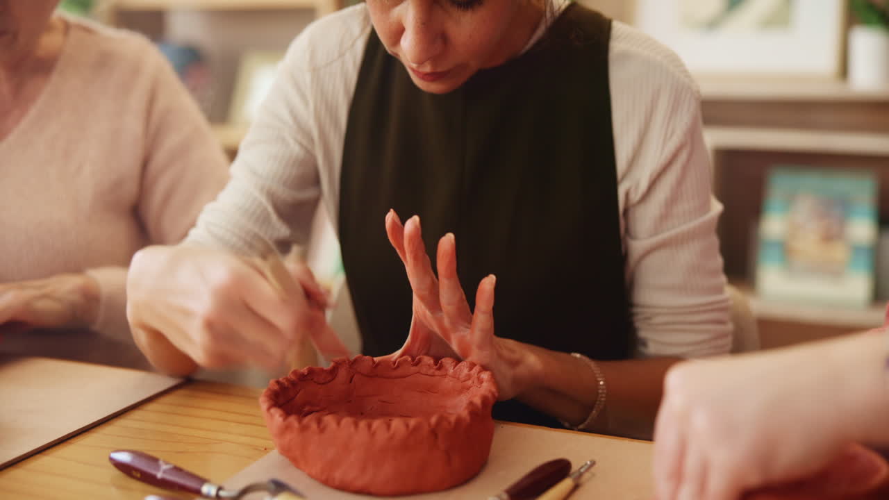 Women learning pottery
