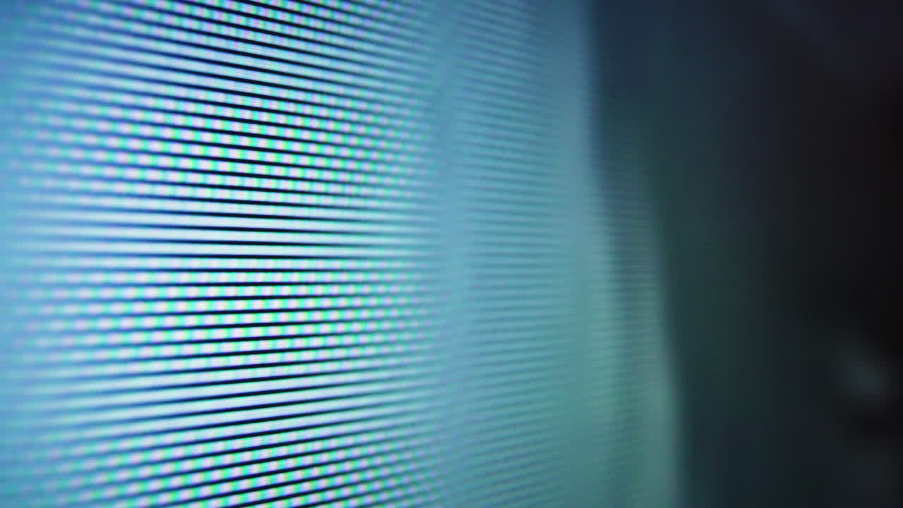 moving pictures on LCD screen of TV with glowing pixels