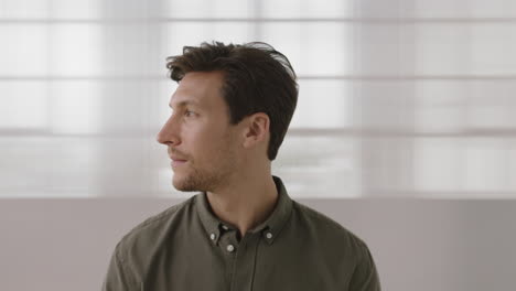 close-up-portrait-of-young-entrepreneur-man-looking-serious-pensive-at-camera-turns-head