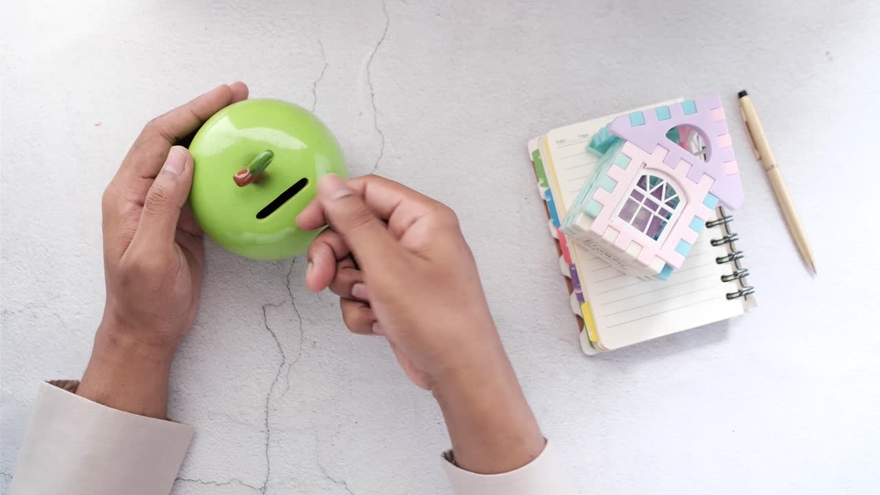 Saving Money with a Piggy Bank and Toy House