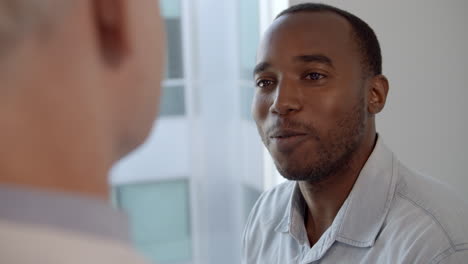 doctor meeting with male patient shot in slow motion on r3d