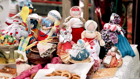 traditional belarusian cuisine - pancakes. attribute of traditional folk celebration of eastern slavic national traditional holiday maslenitsa. winter spring holiday. belarusian folk dolls