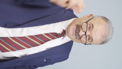 vertical video of thinking old businessman comes up with a great idea.