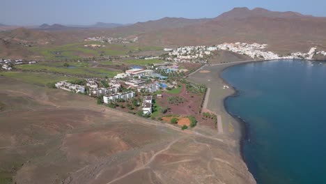 slow aerial approach of the beautiful playitas resort, spain