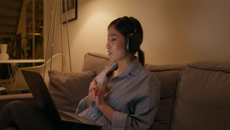 woman having a video call at home at night