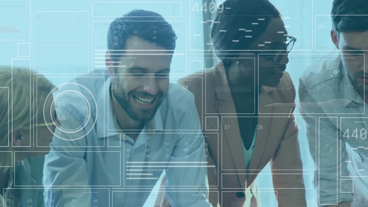 Business team clicking laptop activating overlays while studying data celebrating breakthrough