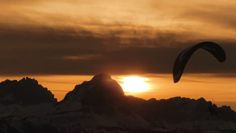 sunset paragliding over the alps