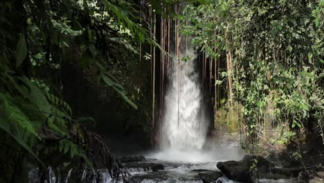 revealing shot sumampan waterfall stream jungle, slow motion