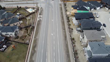 Aerial-view-of-a-modern-suburban-community-in-Calgary,-Canada,-in-spring-after-the-snow-melt