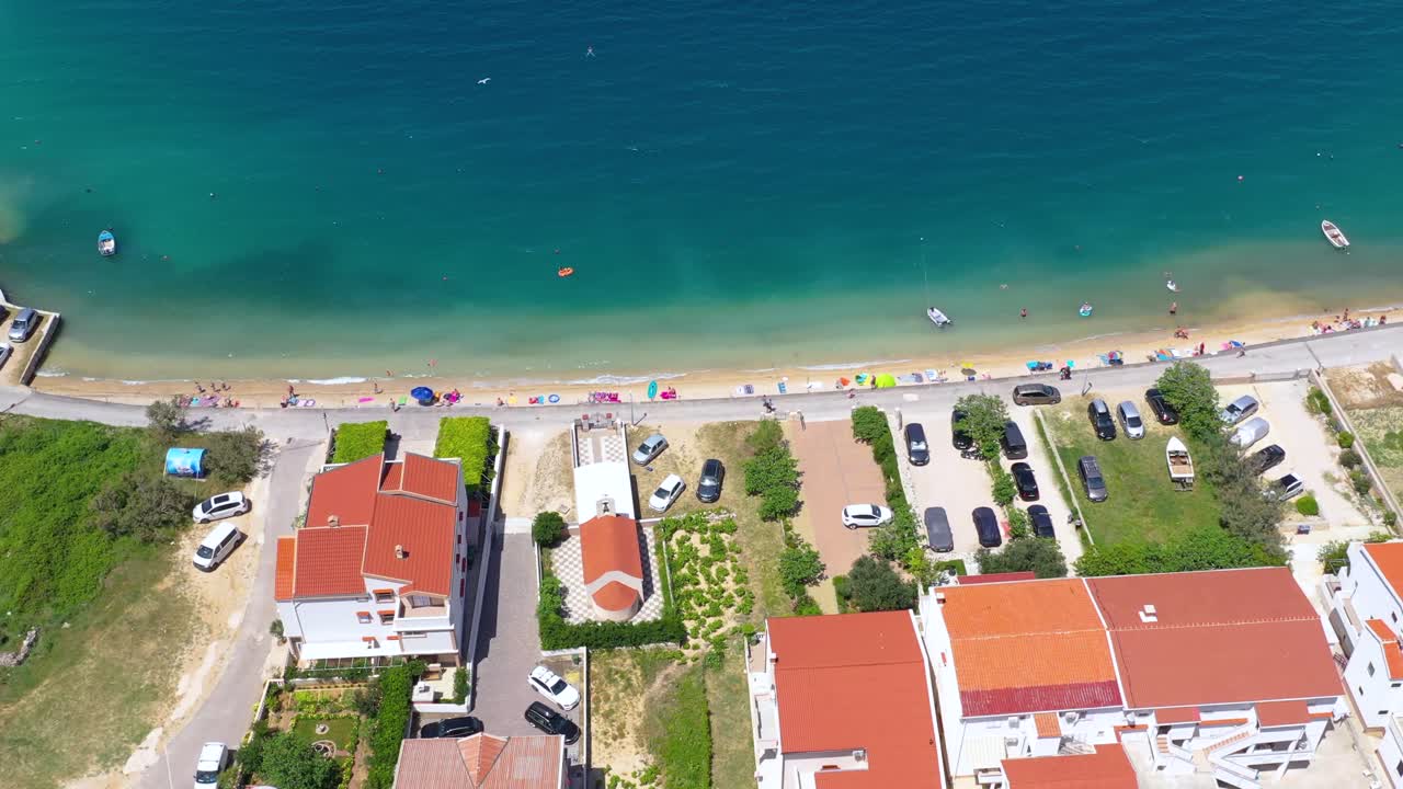 Aerial view of houses and resorts in the paradisiac beach of Pag Island, Croatia