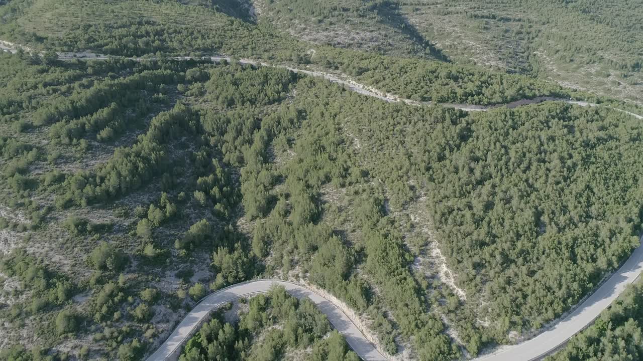 Aerial view of mountain road. Slow forward movement