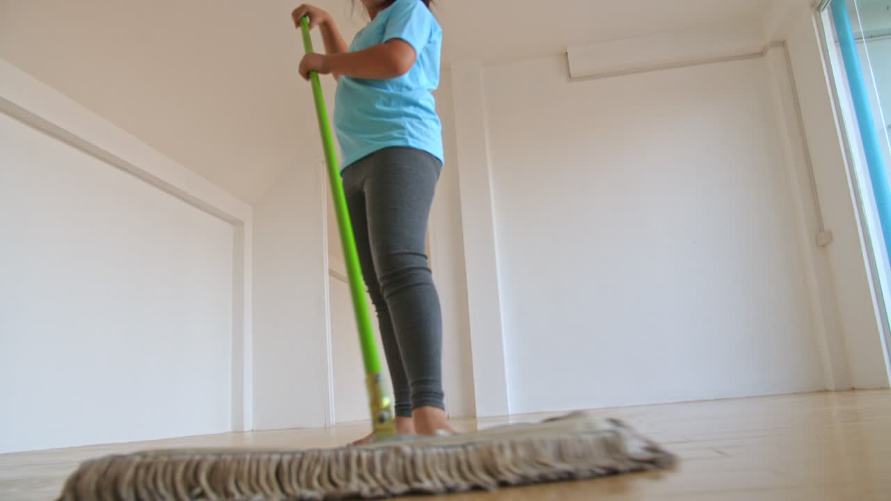 Girl Mopping The Floor