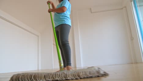 girl mopping the floor