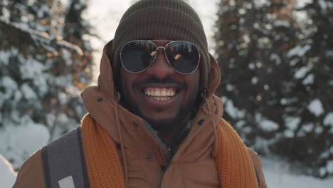 smiling man in winter landscape