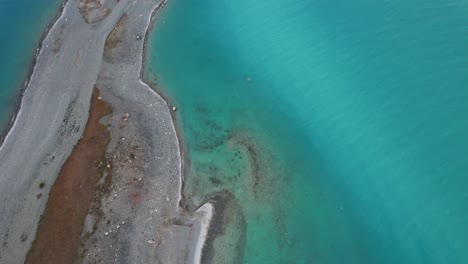 Turquoise Blue Water Of Lake Tekapo In Canterbury, Mackenzie, South Island, New Zealand. - aerial shot