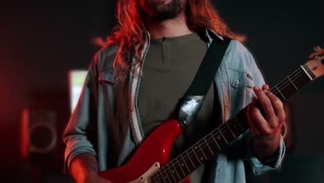 guitarist wearing virtual reality headset while playing guitar