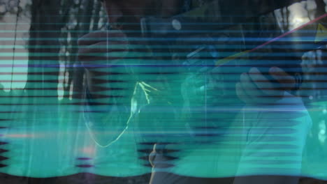 man threading fishing lure outdoors, showing glitchy teal scan lines for fishing industry