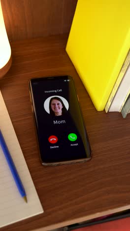 incoming call from mom. vertical shot.