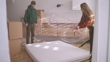 couple moving a mattress