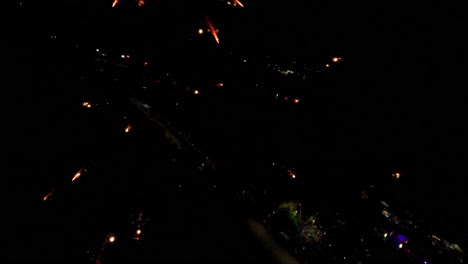 slow motion fireworks at night, vibrant colors in sky, celebration mood
