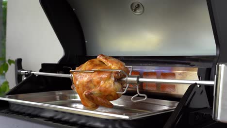 rotisserie chicken is grilled with a rear burner