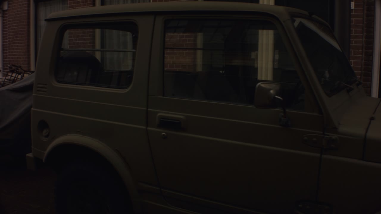Old Ijmuiden - Netherland - January 21st 2019 : circle around view of a vintage jeep truck vehicle car in dutch neighborhood