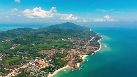 4K-Cinematic-nature-drone-footage-of-a-panoramic-aerial-view-of-the-beautiful-beaches-and-mountains-on-the-island-of-Koh-Lanta-in-Krabi,-South-Thailand,on-a-sunny-day