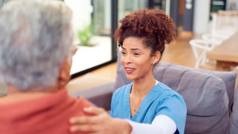 nurse providing support and care to elderly patient