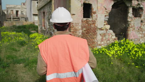 engineer walking at the construction site immersed in the nature