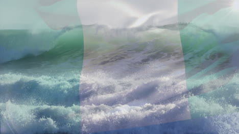 digital composition of waving nigeria flag against aerial view of waves in the sea