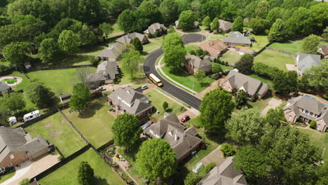 american school transport system - school bus waiting next to a family house