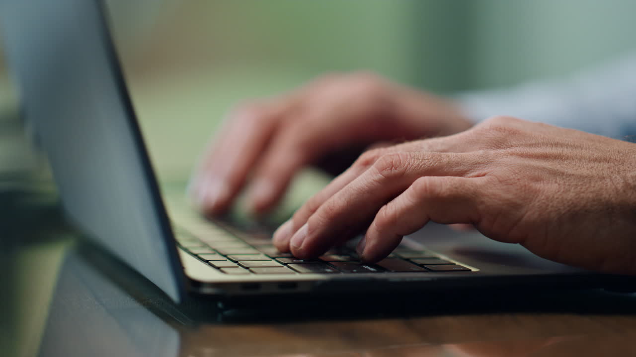 Businessman hands working computer keyboard indoors close up. Boss typing laptop