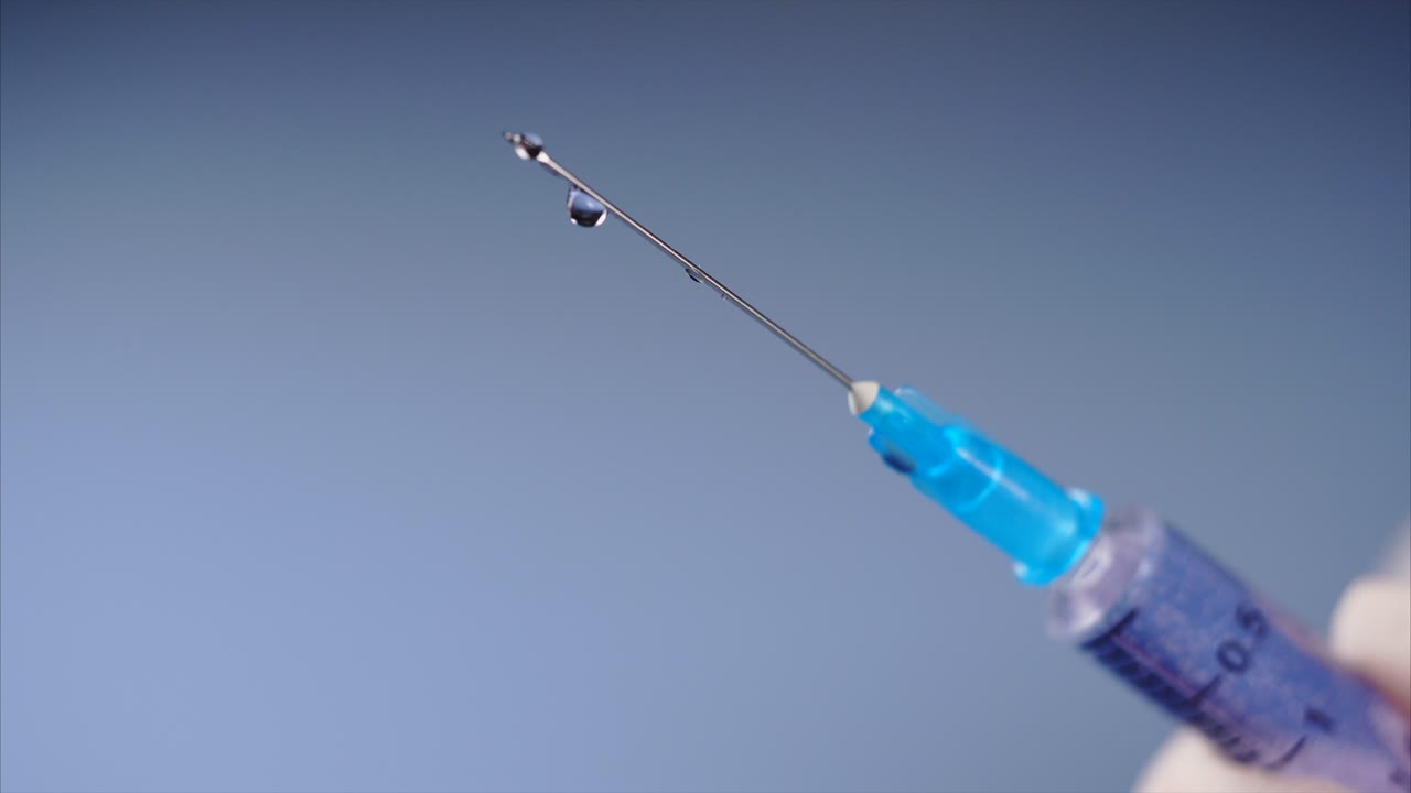 Syringe with Liquid Droplet