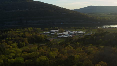 slow aerial footage rotating around moccasin bend during the sunset in chattanooga, tn with the sun reflecting off of the tennessee river