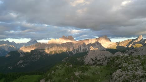 cinematic shot of cortina dolomites at beautiful sunset, croda da lago, italy