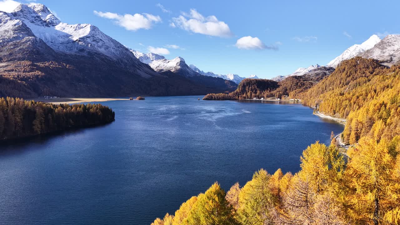Walensee lake and Swiss alps mountains, drone aerial view in autumn season, Walenstadt and Amden blue water, snow peaks and colorful forest landscape in Switzerland