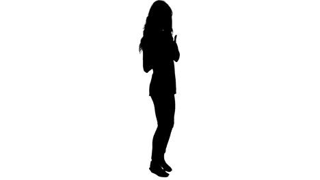 silhouette of woman showing thumbs up