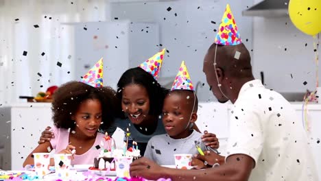 Animation-of-confetti-falling-over-family-having-fun-at-birthday-party