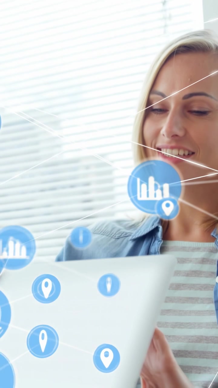Video verticale: Donna che digita su un laptop e analizza icone di dati che crescono e fluttuano intorno a lei.