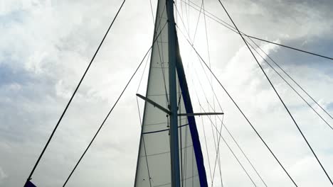 sails and lines of boat against the sky, a storm is coming