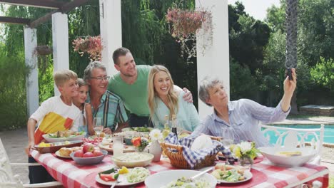happy family eating together at table