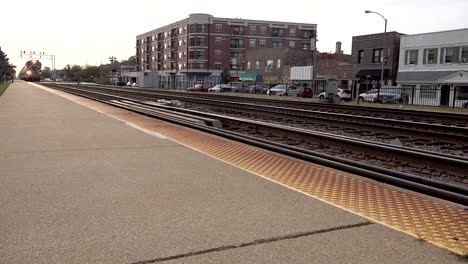 close up of fast commuter passenger train near platform 4k