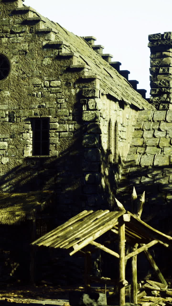 Historic stone house in a mountainous landscape surrounded by trees